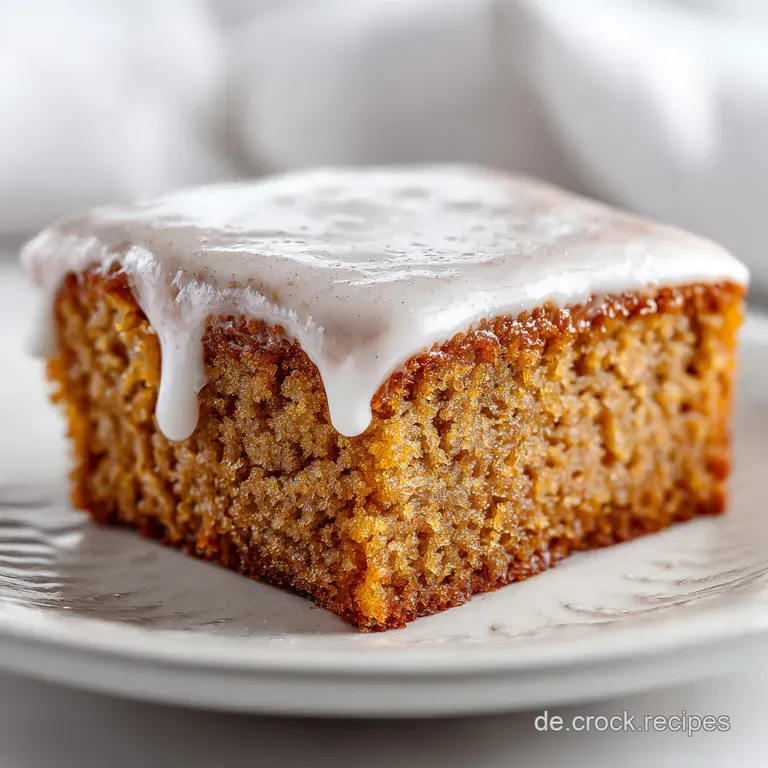 Slice of cinnamon-swirl sheet cake on a white plate. Cake has a moist crumb, appealing golden crust, and light sugar dusting.